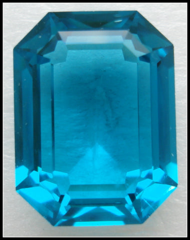 20X15MM (4610) STEP CUT UNF. BLUE ZIRCON CUSHION OCTAGONS