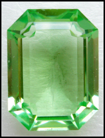 20X15MM (4610) STEP CUT UNF. PERIDOT CUSHION OCTAGON