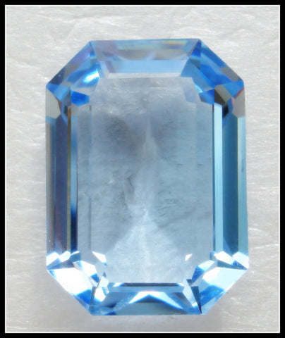 18X13MM (4610) UNF. LIGHT SAPPHIRE STEP CUT CUSHION OCTAGONS